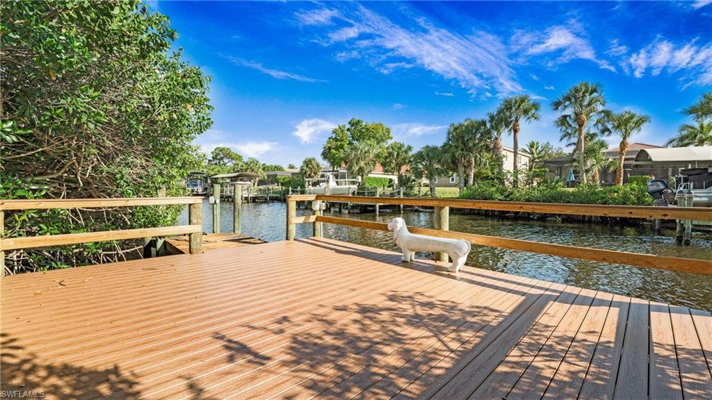 Image 3: Dock featuring a water view
