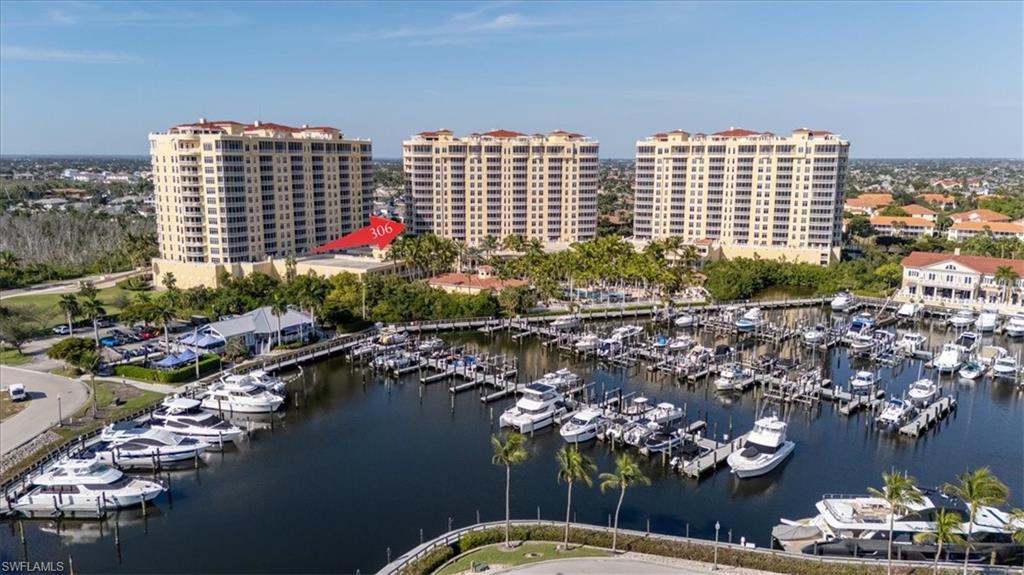 Image 2: Bird's eye view of numerous boat docks and a nearby body of water