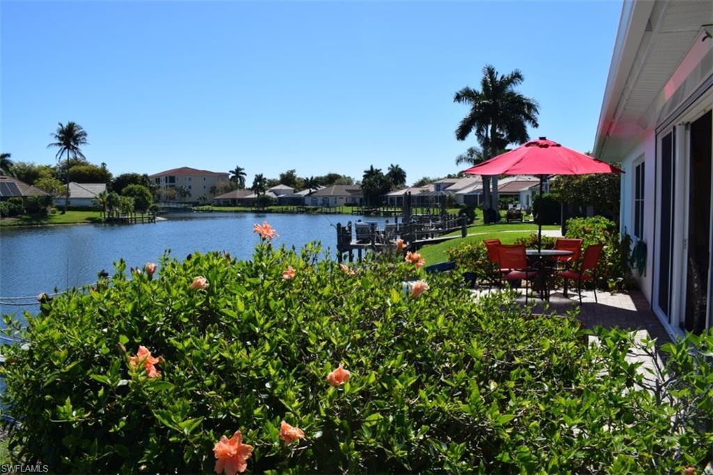 Image 4: Patio area looking onto the water in back of home