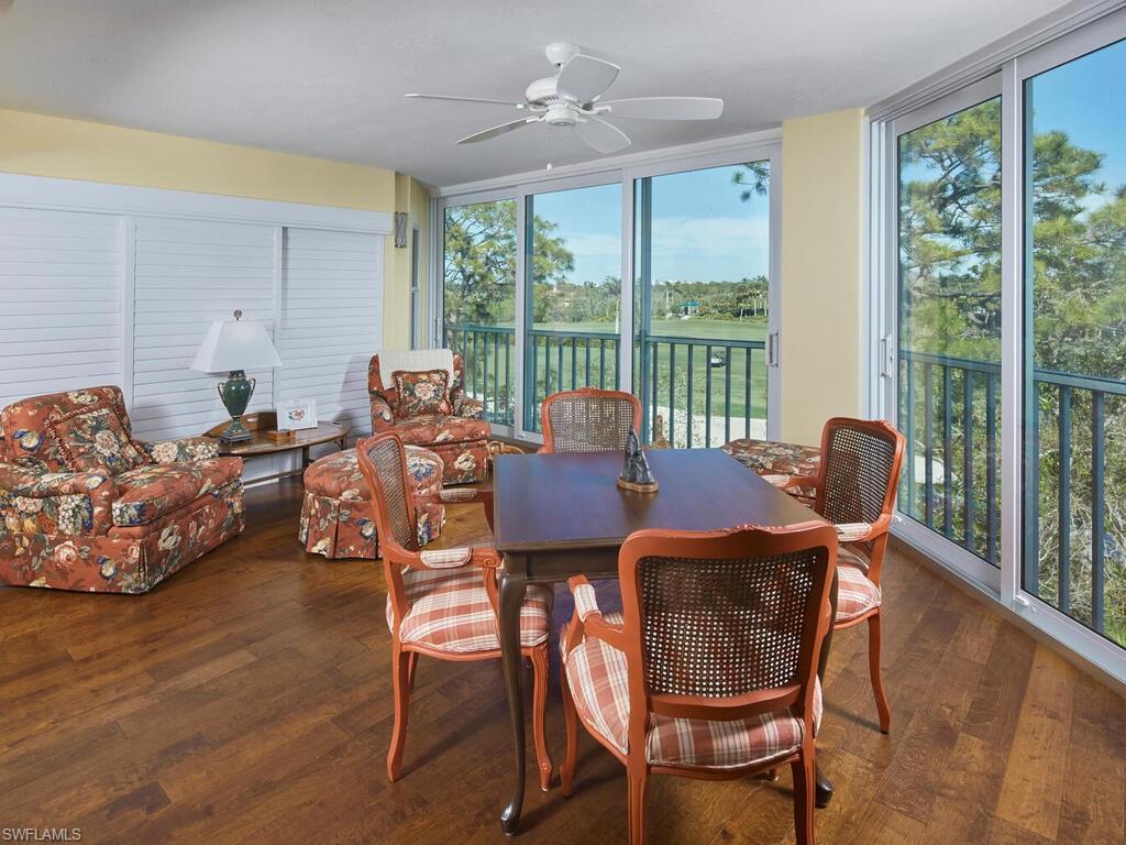 Image 3: Sunroom featuring Glassed-in lanai with impact resistant glass, engineered wood flooring and views that are absolutely gorgeous!