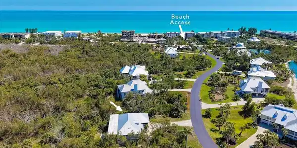 Image 2: Coastal community featuring direct beach access, paved roadways, and modern architecture