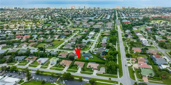 Image 2: Expansive neighborhood featuring a grid of residential properties and roadways