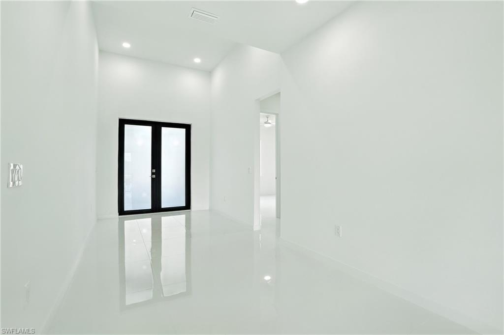 Image 3: Unfurnished room with recessed lighting and french doors