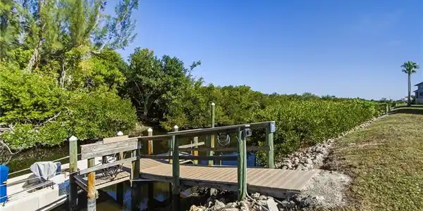 Image 4: Dock in the backyard with water and electrical