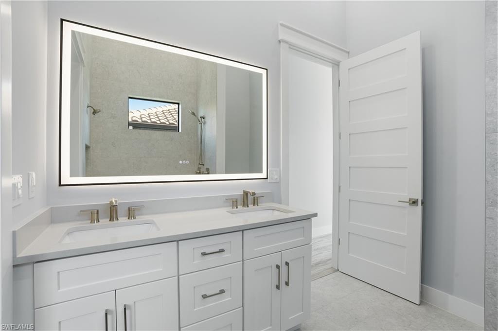 Image 3: Full bath with tiled shower and double vanity