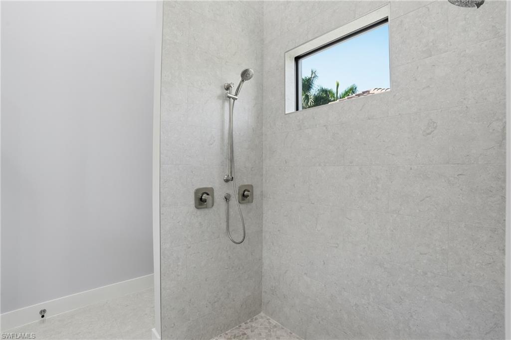 Image 4: Full bathroom with a tile shower
