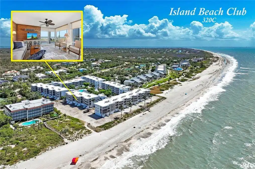 Image 1: Island Beach Club offers a striking oceanfront community featuring modern multi-story residential buildings with clean architectural lines, direct beach access along pristine sandy shores, and expansive grounds with mature landscaping