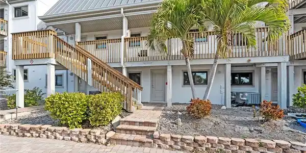 Image 4: Completely remodeled, bayfront, and move-in ready &mdash; this condo captures relaxed island living from every angle.