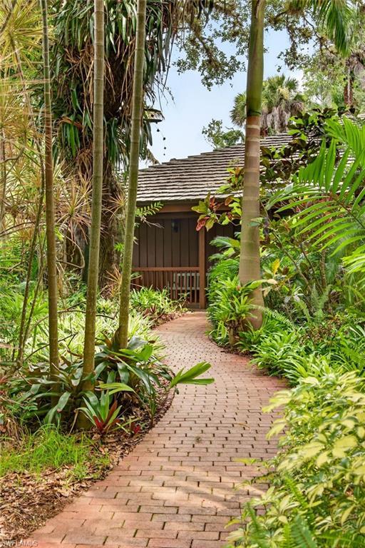 Image 3: Brick paver pathway to the front door from driveway