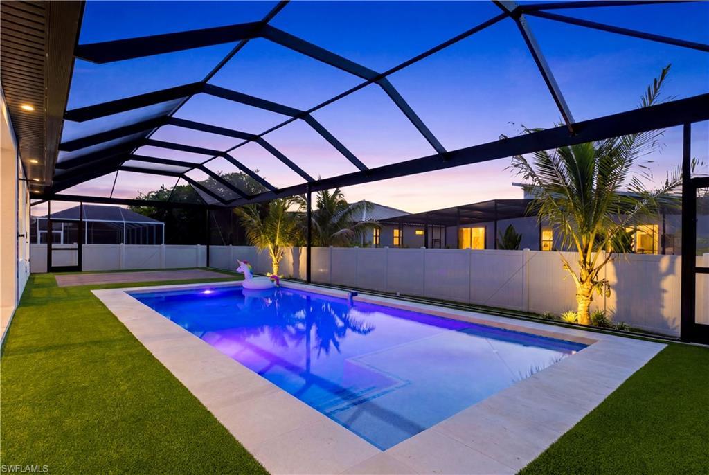 Image 3: Start your mornings w/ beautiful eastern rear exposure & abundant natural light while enjoying coffee poolside in your private tropical retreat!
