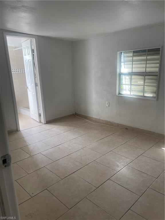 Image 3: View of tiled spare room