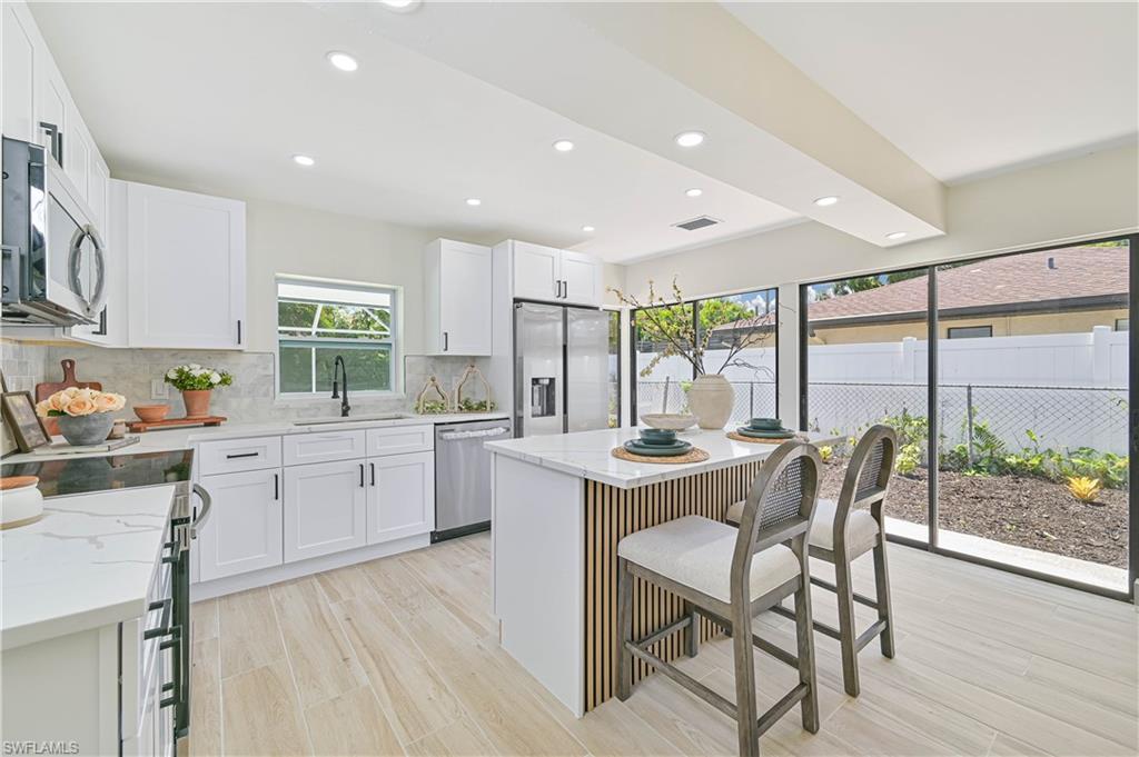 Image 3: kitchen with tons of nature light