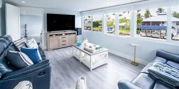 Image 4: Living room featuring light wood finished floors and recessed lighting