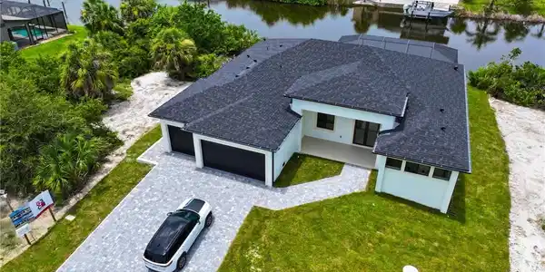 Image 2: View from above of property with a large body of water