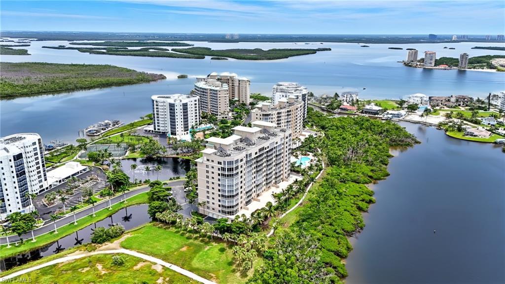 Image 4: View of urban area with apartment complex / building and a large body of water - Virtually Edited Image