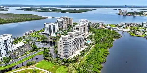 Image 4: View of urban area with apartment complex / building and a large body of water - Virtually Edited Image