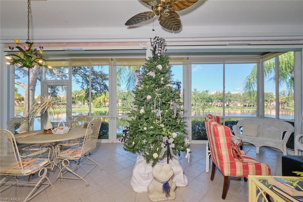 Image 4: Sunroom with a wealth of natural light, ceiling fan, and a water view