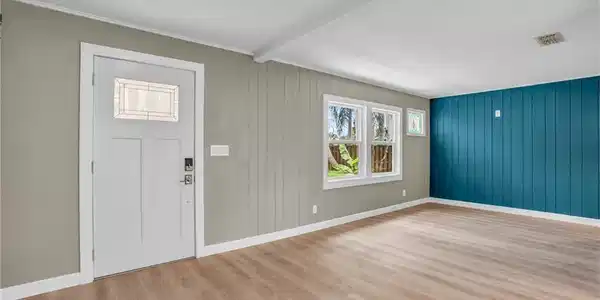 Image 3: Foyer with visible vents, baseboards, beamed ceiling, and wood finished floors