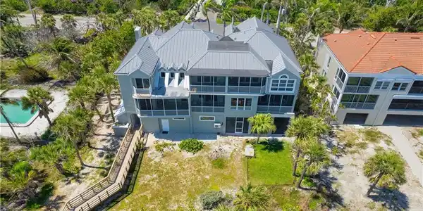 Image 2: Rear of Property with private beach boardwalk