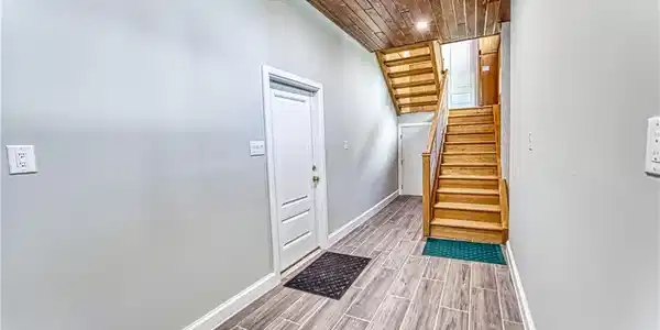 Image 4: Lower Level Entry from Garage with Storage Closet