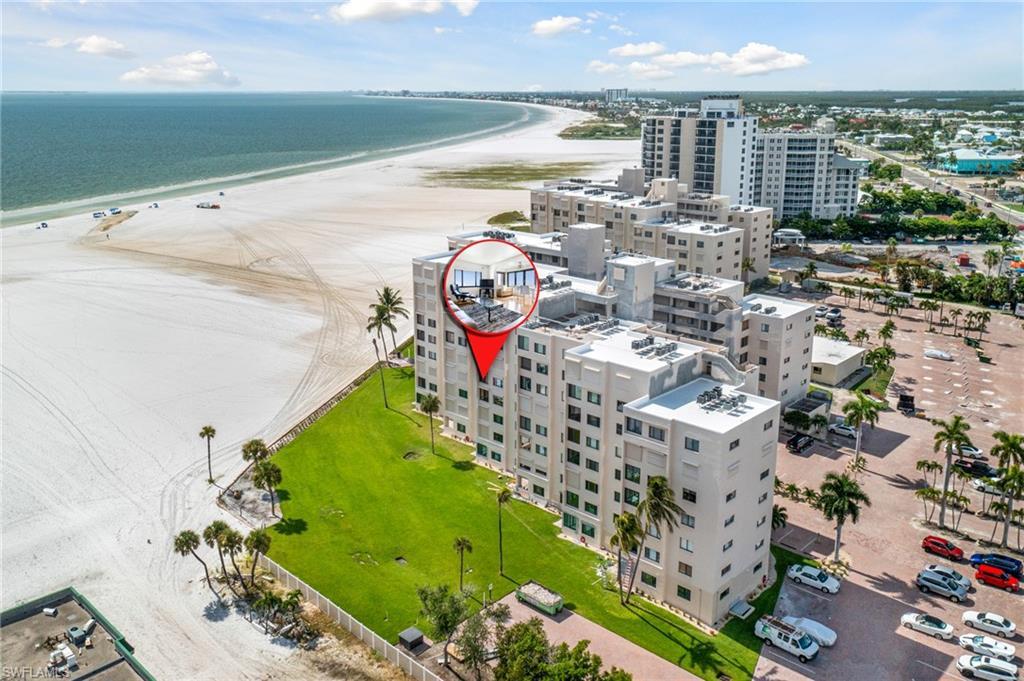 Image 1: Aerial view with a water view and a view of the beach