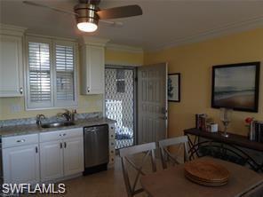 Image 4: Kitchen with ceiling fan, white cabinets, sink, dishwasher, and crown molding