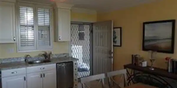Image 4: Kitchen with ceiling fan, white cabinets, sink, dishwasher, and crown molding