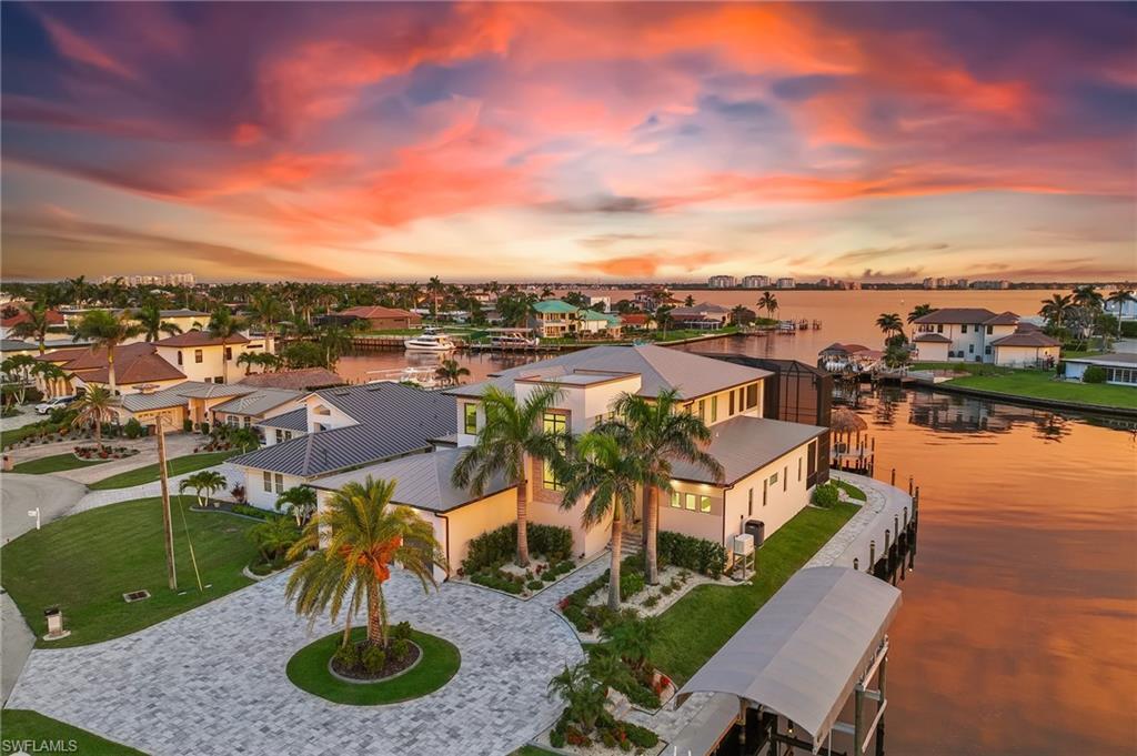 Image 3: Rear view of property featuring a patio, a balcony, a lanai, and an outdoor pool