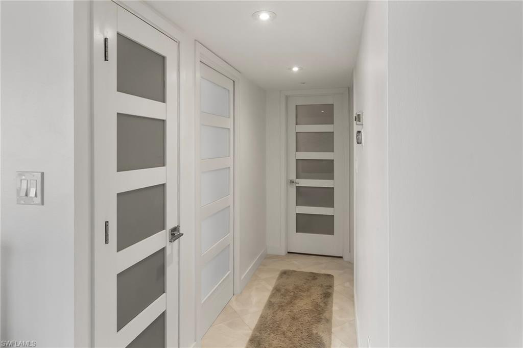 Image 4: Corridor featuring recessed lighting and light tile patterned floors