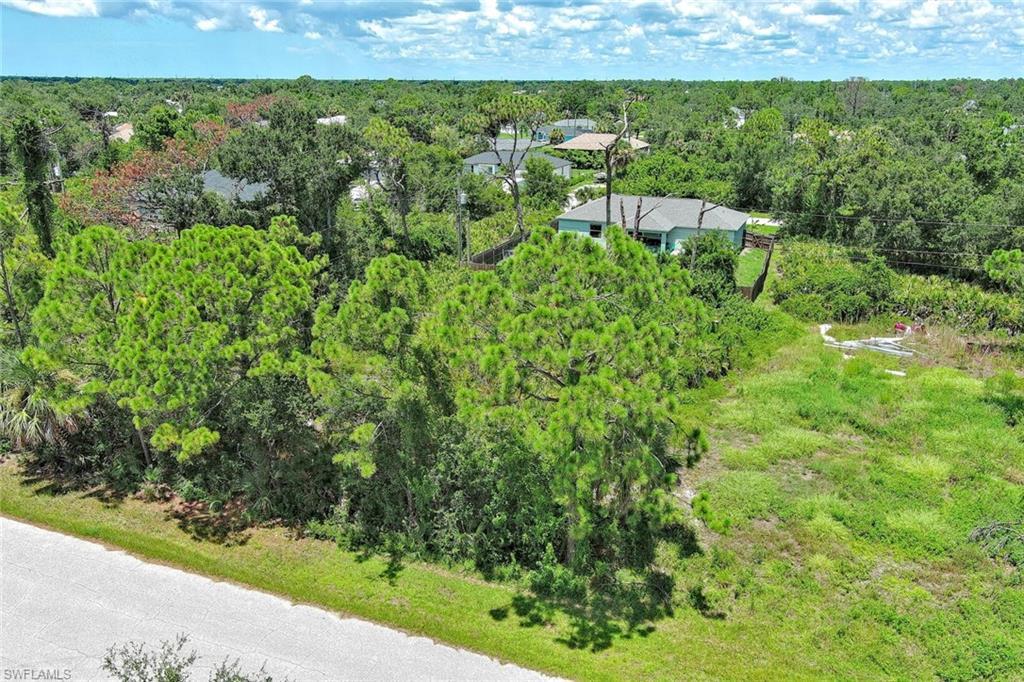 Image 3: View from above of property featuring a heavily wooded area