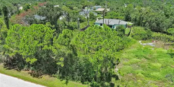 Image 3: View from above of property featuring a heavily wooded area