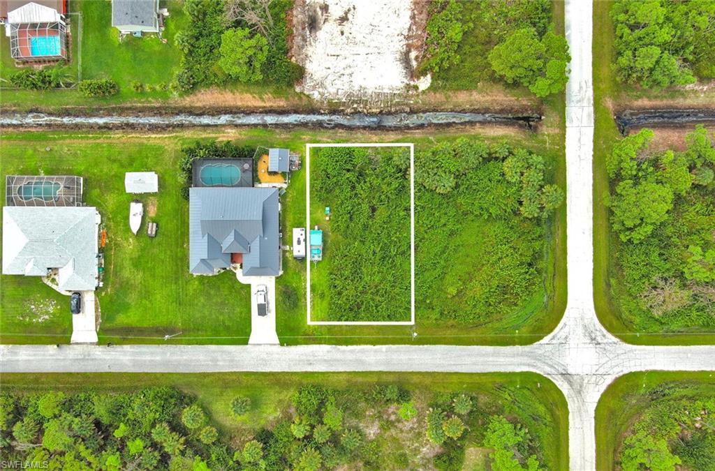 Image 2: Aerial overview of property's location with property parcel outlined