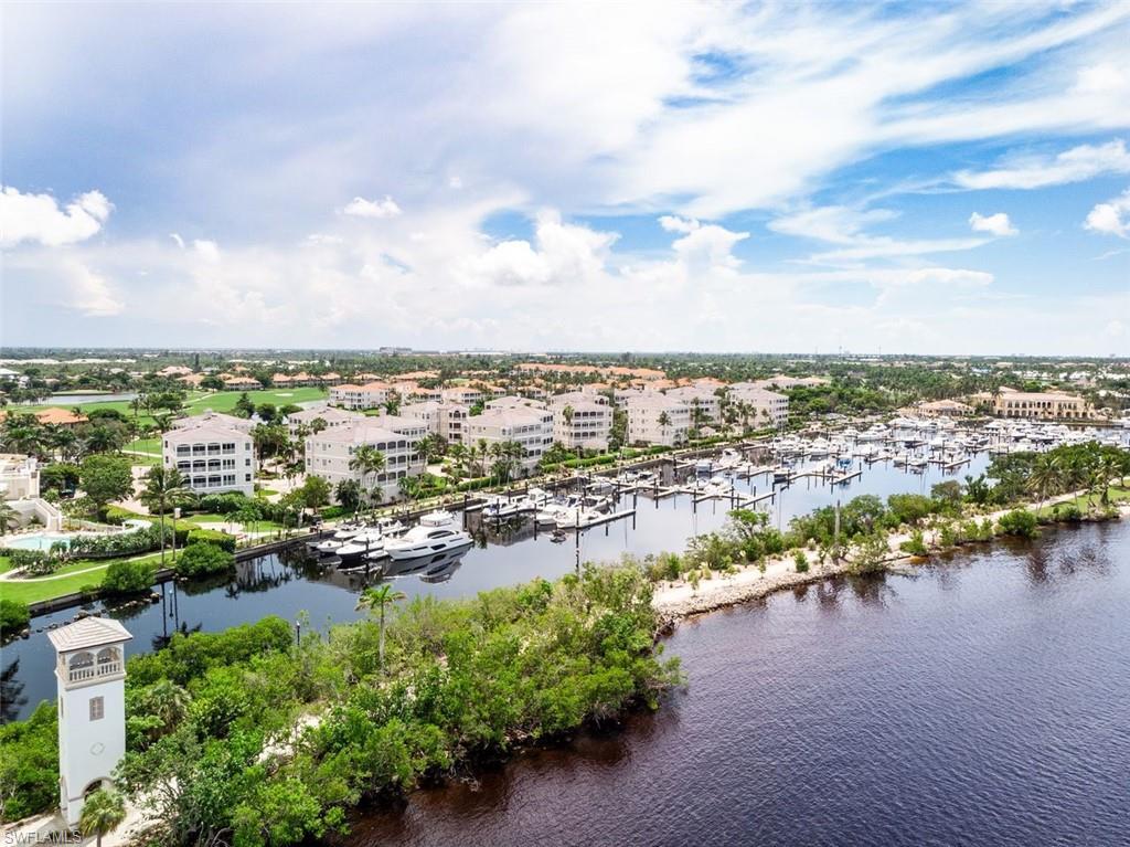 Image 4: Drone / aerial view of numerous boat docks and a nearby body of water