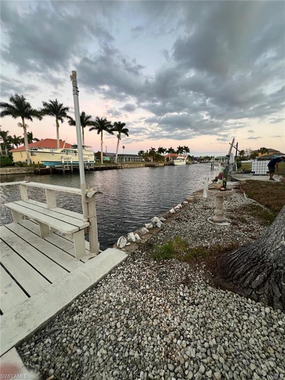 Image 4: Dock area featuring a water view