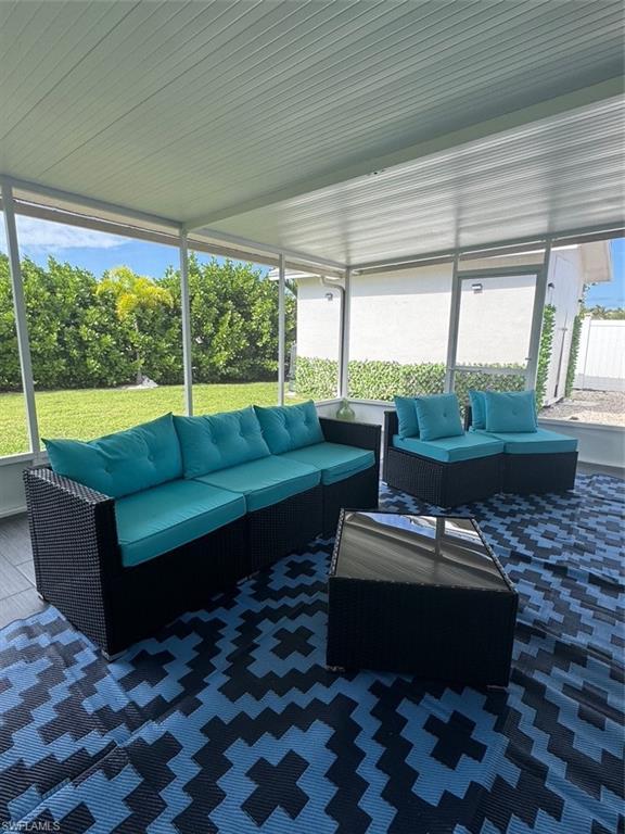 Image 4: View of patio / terrace featuring a sunroom and an outdoor living space