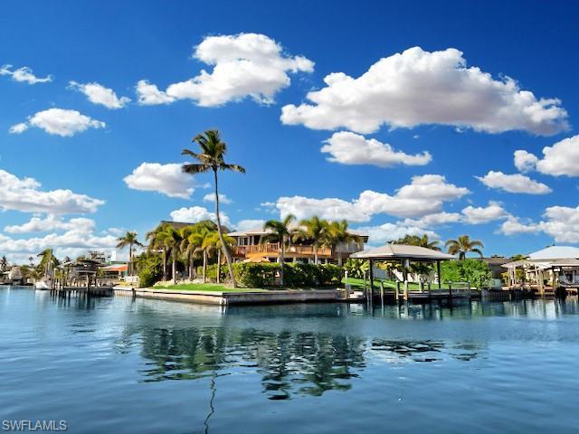 Image 3: Perched on an elevated lot, this home offers natural flood protection&mdash;a standout feature that ensures safety and peace of mind!