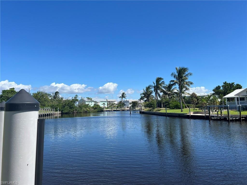 Image 2: Water view with a boat dock