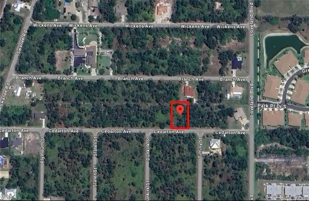 Image 1: Aerial view of property's location featuring property parcel outlined