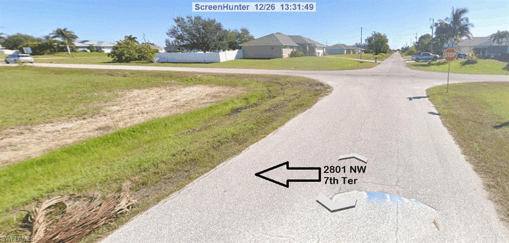 Image 2: View of property looking down street.