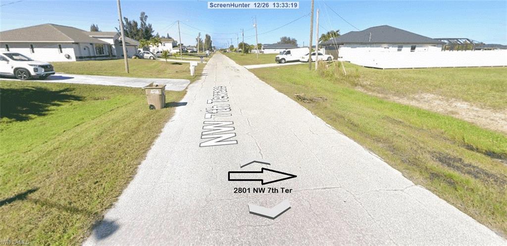 Image 3: View of property looking up street.