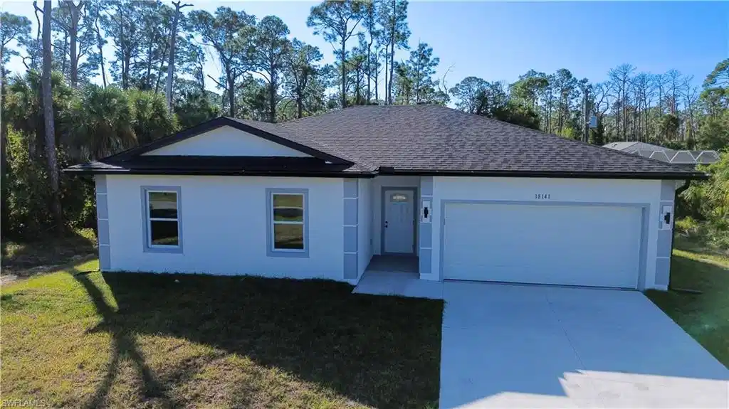 Image 1: Single story home featuring a shingled roof, concrete driveway, a front yard, a garage, and stucco siding