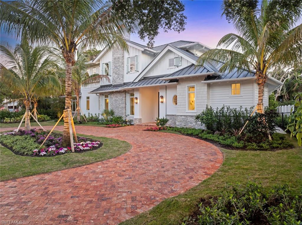 Image 1: View of front of property featuring a lawn