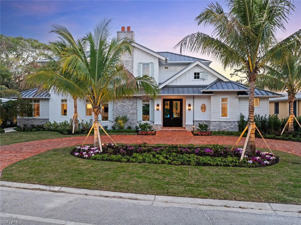 Image 2: View of front of house with a yard