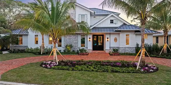 Image 2: View of front of house with a yard