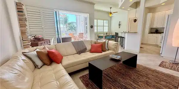 Image 2: Living room with light tile patterned floors