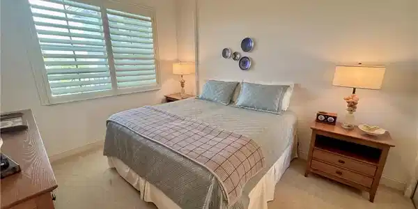 Image 4: Guest bedroom featuring ceiling fan and connected guest bathroom