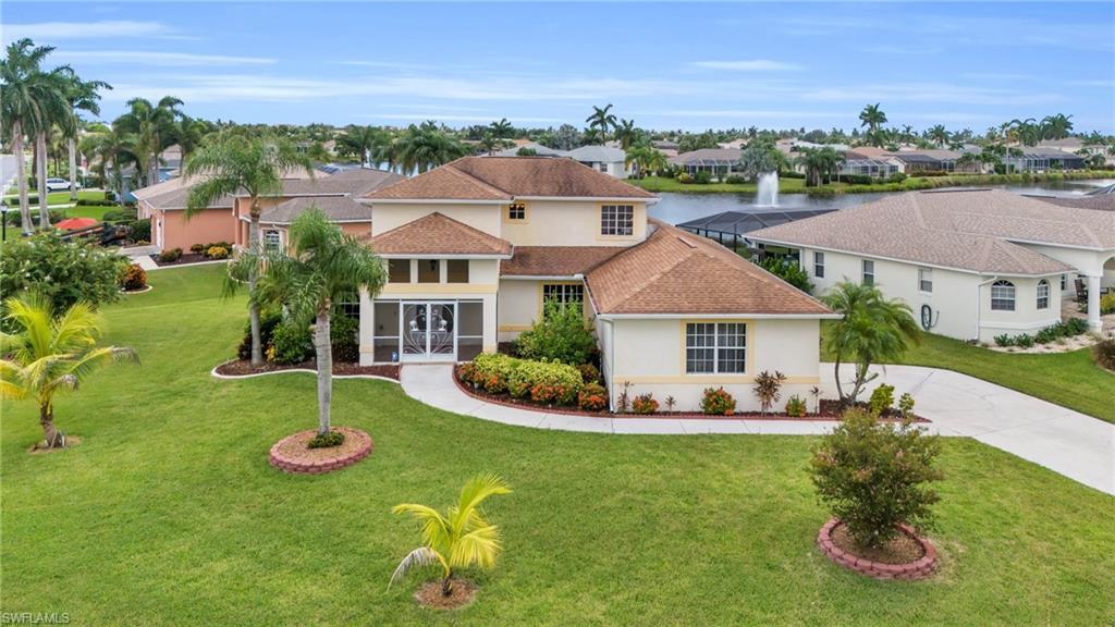 Image 1: Mediterranean / spanish home featuring a front yard