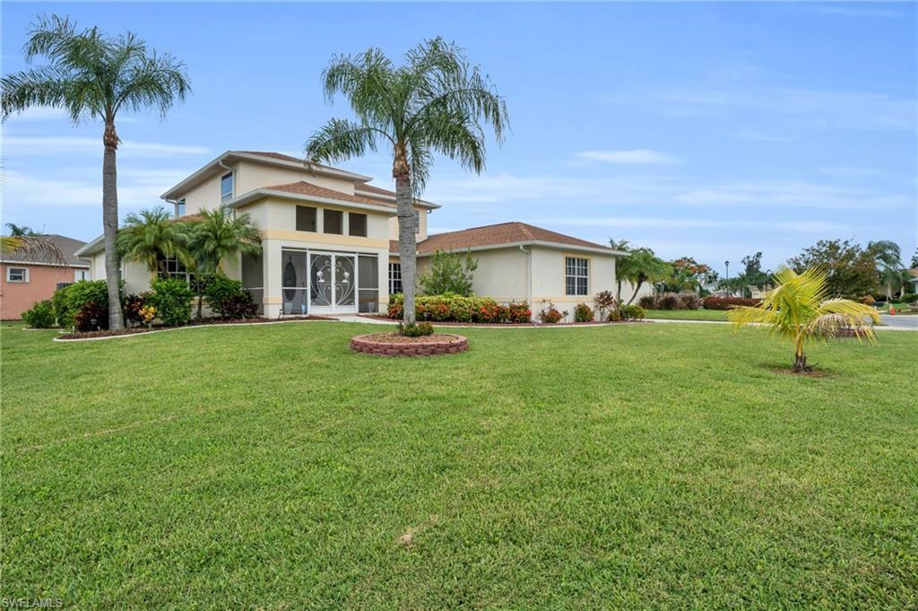 Image 2: View of front of property featuring a sunroom and a front yard