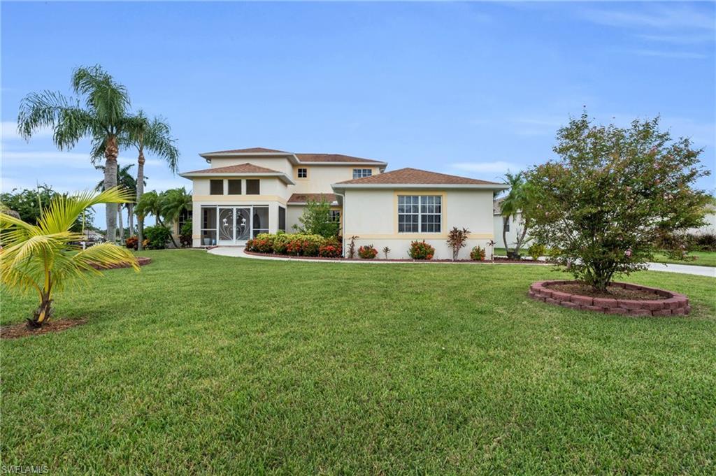 Image 3: View of front facade with a front lawn