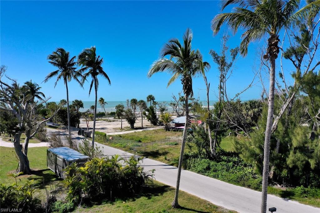 Image 2: View of street featuring a water view